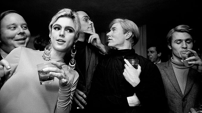 Steve-Schapiro-Edie-Sedgwick,-Andy-Warhol,-and-others-at-a-party-1965