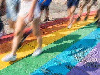 People-walking-on-a-rainbow-footpath