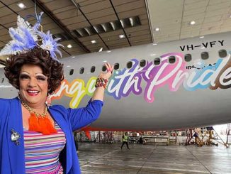 Dolly Diamond with the Jetstar Airbus A320 displaying the Flying With Pride livery